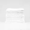 Stack of 12x12 Economy White Washcloths in Bulk