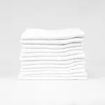 Stack of 12x12 Economy White Washcloths in Bulk
