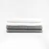 Stack of 12x44 White and Grey Fitness Towels