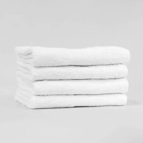 Stack of 15x25 Economy White Hand Towels in Bulk