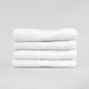 Stack of 15x25 Economy White Hand Towels in Bulk