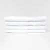 Stack of 24x48 Economy White Bath Shower Towels