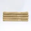 Stack of 24x50 Tan Locker Room Towels