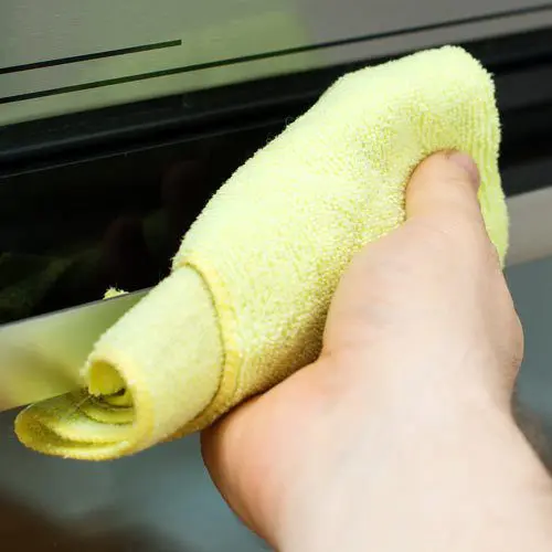 Man Cleaning Using Bulk Microfiber Towels