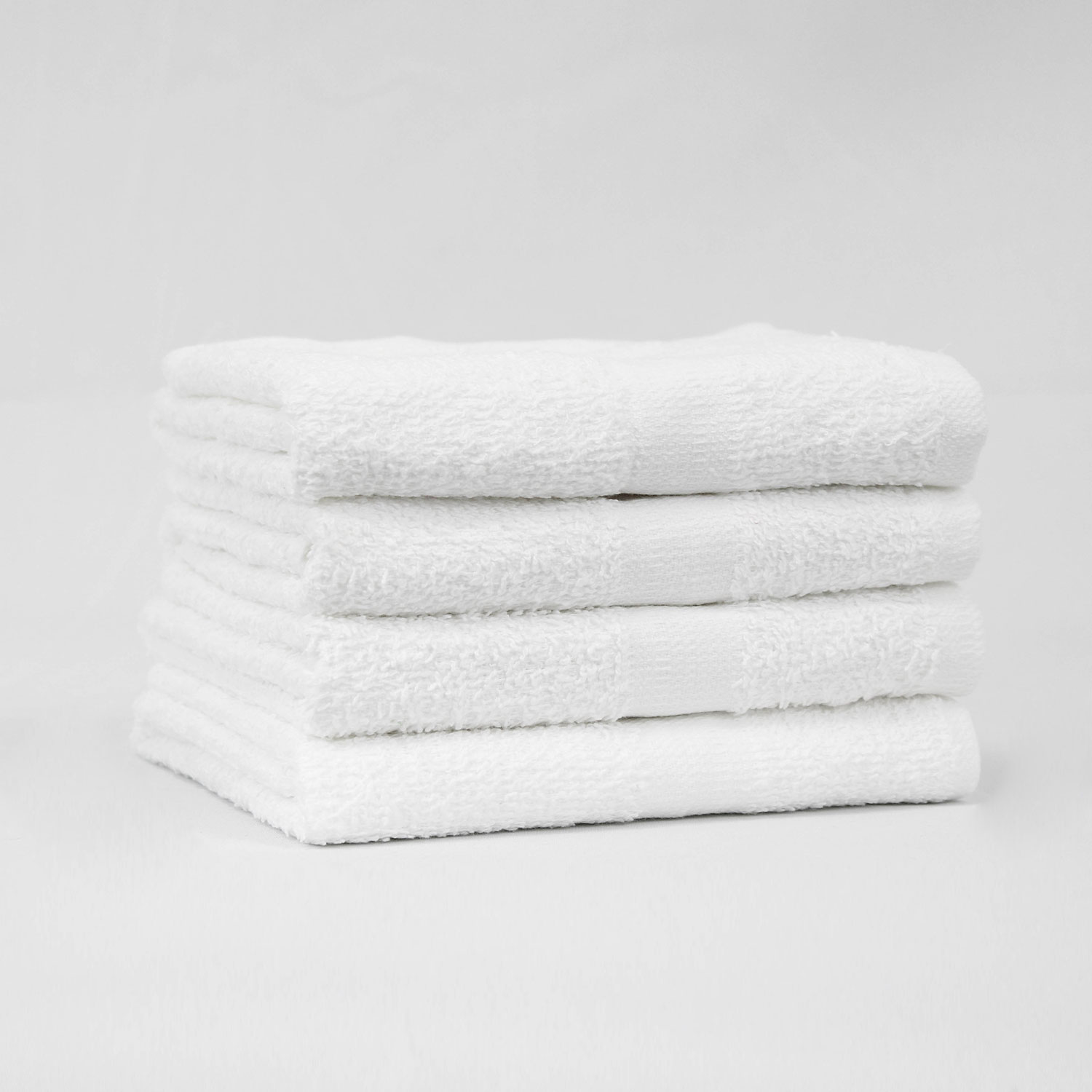 Stack of 16x27 Economy White Hand Towels