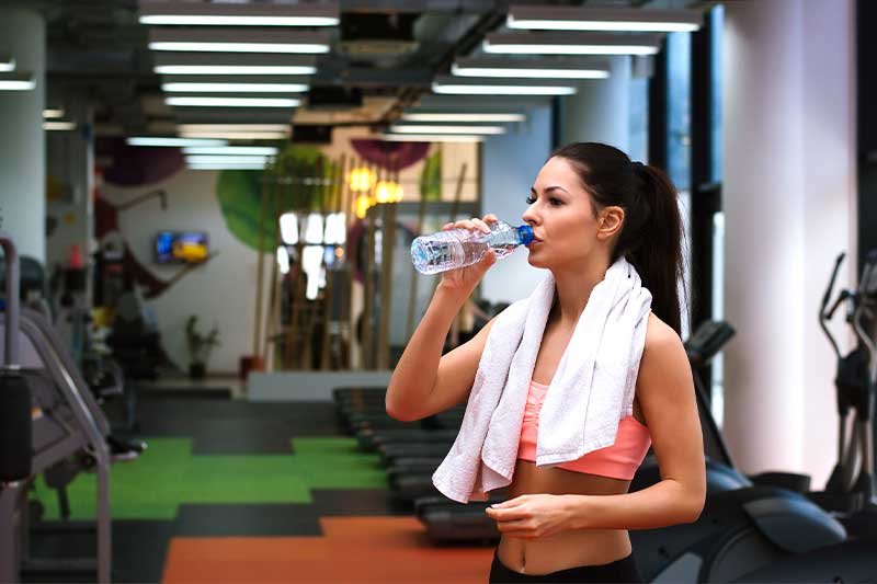 woman absorbing sweat with texon gym towel