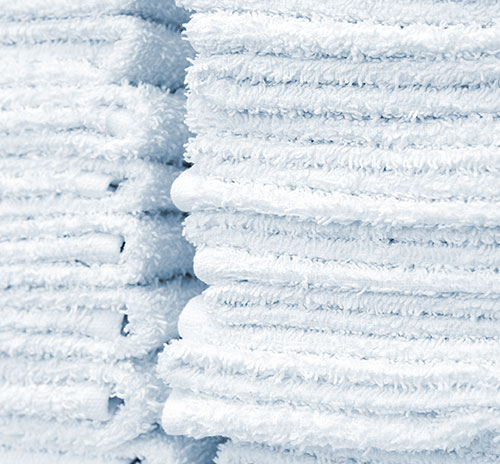 stack of examples of towels in bulk that you can buy