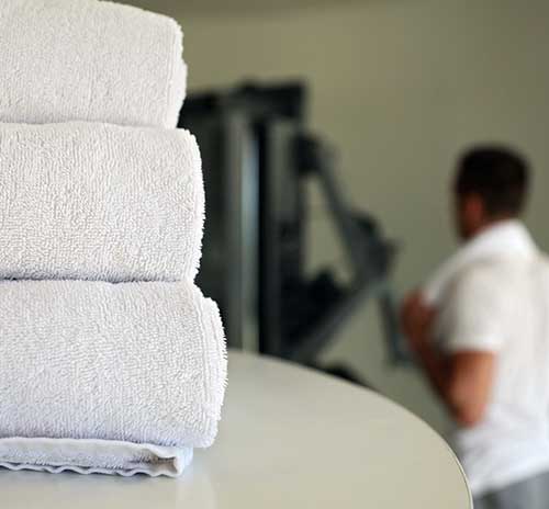 man wondering the gym questioning where to buy cheap gym towels