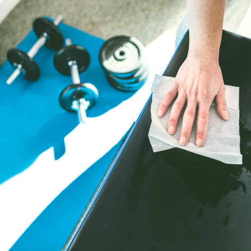 Woman Cleans With Bulk Disinfectant Wipes